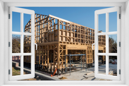 Fototapeta Naklejka Na Ścianę Okno 3D - Wooden frame of a new house under construction