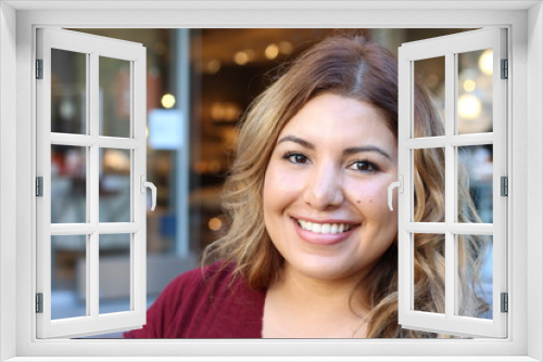 Portrait of a young Hispanic female smiling