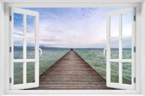Fototapeta Naklejka Na Ścianę Okno 3D - wooden pier and sky over Garda lake - Italy