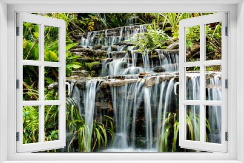 Fototapeta Naklejka Na Ścianę Okno 3D - Artificial waterfall in botanic garden