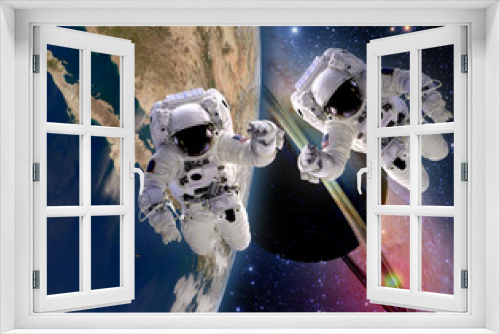 Fototapeta Naklejka Na Ścianę Okno 3D - Two astronauts handshake spaceman sun saturn planet sci fi earth outer space galaxy. Elements of this image furnished by NASA.