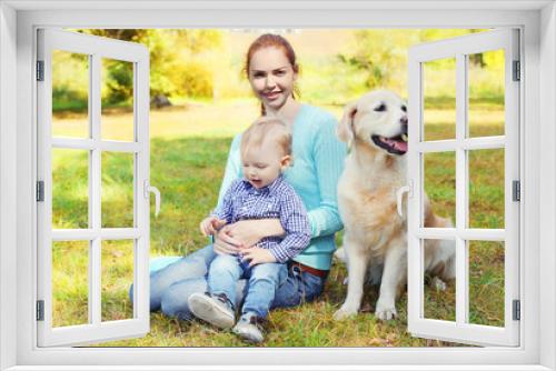 Fototapeta Naklejka Na Ścianę Okno 3D - Happy mother and child with Golden Retriever dog on grass in par