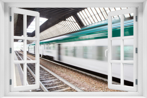 Fototapeta Naklejka Na Ścianę Okno 3D - Fast Passenger Commuter Train with Motion Blur