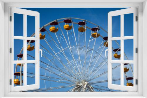 Fototapeta Naklejka Na Ścianę Okno 3D - Ferris wheel over blue sky