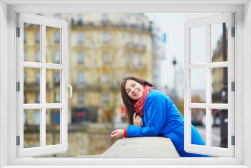 Beautiful young tourist in Paris on a fall or spring day