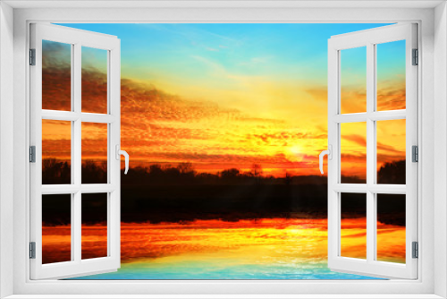 Fototapeta Naklejka Na Ścianę Okno 3D - Kolorowy zachód słońca z odbiciem w jeziorze.