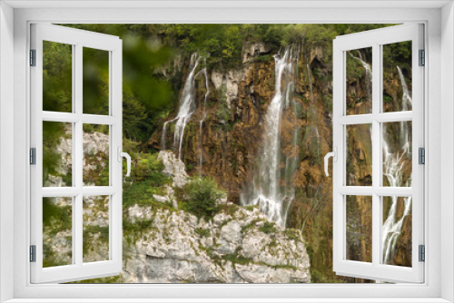 Fototapeta Naklejka Na Ścianę Okno 3D - Beautiful waterfalls among green mountains