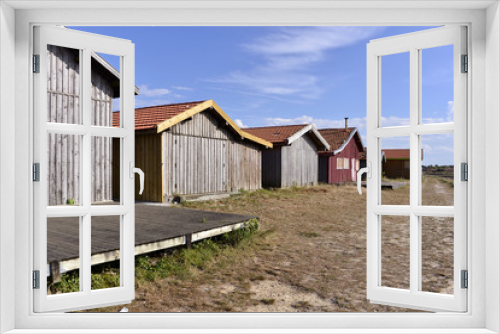 Fototapeta Naklejka Na Ścianę Okno 3D - Wooden cabins at Larros in France