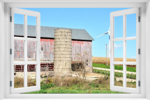 Fototapeta Naklejka Na Ścianę Okno 3D - Old Barn and Modern Windmill