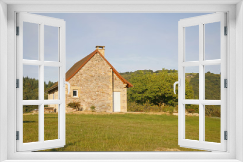 Fototapeta Naklejka Na Ścianę Okno 3D - Stone house on hill in green garden, Correze, France