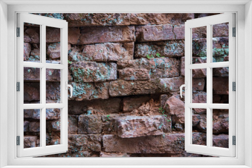Fototapeta Naklejka Na Ścianę Okno 3D - Old and broken red stone brick wall
