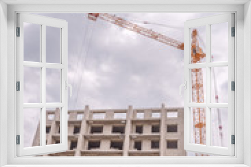 Building multistorey houses and hoisting cranes